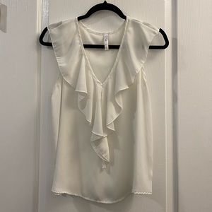 White sleeveless V-neck blouse
